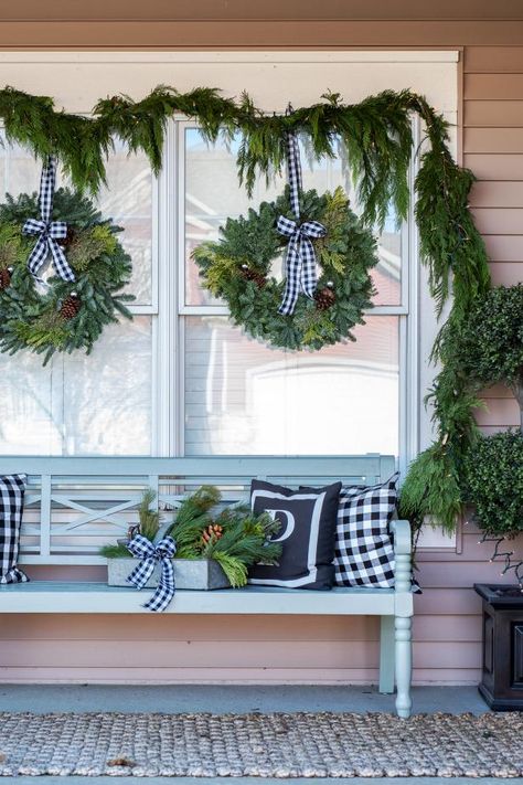 HGTV's Christmas craft pros share tips for hanging holiday wreaths on your windows without damaging the window's frame or glass. Wreath Exterior Windows, Wreaths On Storm Doors, Christmas Wreaths Windows Outdoor, How To Hang Wreaths On Windows Outdoor, Christmas Window Wreath Ideas, Exterior Christmas Wreaths On Windows, Window Wreath Outdoor, Hanging Wreaths On Windows With Ribbon, Wreaths For Windows Outside