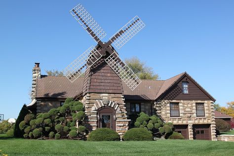 Windmill House - Wheaton, Illinois: - Built in 1942 from materials salvaged from a nearby farm, the Windmill House has an old-fashioned windmill above its front door, and is surrounded by otherwise normal suburban homes. Vertical Windmill, Wheaton Illinois, Windmill House, Windmill Water, Wind Mill, Grayscale Coloring Books, Unusual Homes, Water Mill, Water Wheel