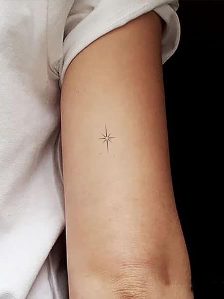 50 Dreamy Star Tattoos and Their Meanings (2022) - The Trend Spotter Sparkle Tattoo Meaning, Single Star Tattoo, Single Star Tattoo Designs, North Star Best Friend Tattoo, Super Star Tattoo, North Star Finger Tattoo, Micro Star Tattoo, Moravian Star Tattoo, Bethlehem Star Tattoo