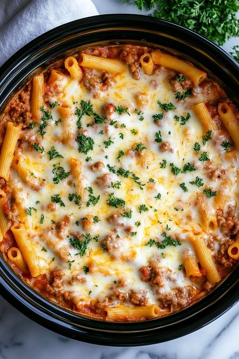 Slow Cooker Baked Ziti - Craving the ultimate comfort food without the fuss? Let’s dive into Slow Cooker Baked Ziti—perfect for those busy days when you want something hearty but don’t have hours to spend in the kitchen. This dish has become one of my favorites because it’s truly a “set it and forget it” Slow Cooker Ziti With Meat, Crockpot Baked Ziti With Meat, Baked Ziti Crockpot, Slow Cooker Ziti, Crock Pot Ziti, Italian Crockpot Recipes, Slow Cooker Baked Ziti, Budget Friendly Dinner Recipes, Camp Meals