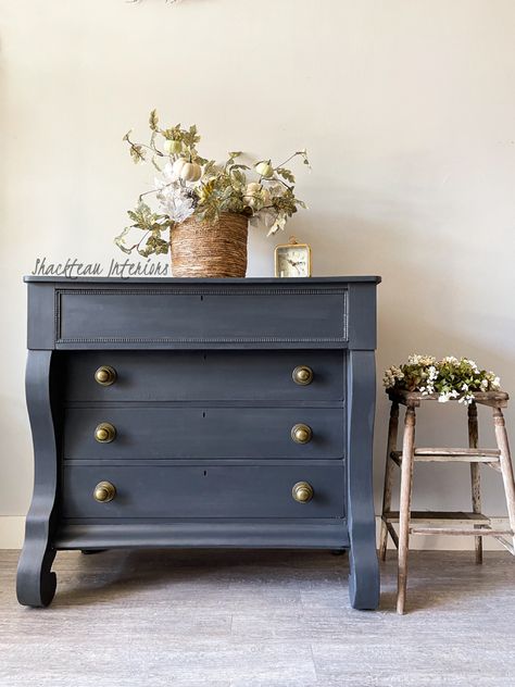 Just listed! This eye-catching Antique Empire Dresser is the perfect statement piece for any bedroom. Handcrafted from solid wood, this dresser has a unique antique empire style and is painted in a charcoal hue for a timeless look. Bring a touch of vintage charm to your home. It is painted with Shackteau Interiors Milk Paint in Quarry and has antique brass knobs. It measures 41 1/4 inches wide 19 1/2 inches deep 37 3/4 high. Stained Dresser, Navy Furniture, Waverly Chalk Paint, Antique Hutch, Navy Paint, Blue Dresser, Baby Dresser, Large Dresser, Beautiful Dresser