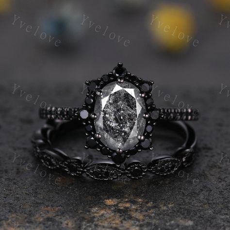 Gothic Oval Shape Salt and Pepper Diamond Engagement Ring Set,Black Gold Diamond Promise Ring Unique Rhodium Black Witchy Ring Bridal Gift,Anniversary Ring Gift For Her,moissanite band ,antique ring set for women Material: Solid gold (10k 14k 18k rose gold,yellow gold,white gold,Platinum available) Main stone:6x8mm oval Cut natural Salt and Pepper Diamond(Every stone will be unique and vary!) Side stone:with black spinel halo and wedding band  0.25ct round cut real diamonds Band width:approx 1.8 Gothic Wedding Rings His And Hers, Rose Gold Black Diamond Ring Engagement, Black Silver Engagement Ring, Black Rings For Women Engagement, Rose Gold And Black Engagement Ring, Vintage Gothic Wedding Rings, Gothic Wedding Rings Set, Gothic Engagement Ring Victorian, Moody Engagement Ring