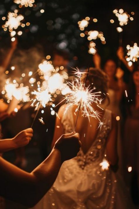 People holding sparklers at an evening celebration, with a person in a wedding dress in the center. Wedding Action Shots, Wedding Photography Settings, Wedding Shots Alcohol, Detail Wedding Shots, Details Shots Wedding, Wedding Detail Shots, Wedding Photography Shot List, Wedding Photography Detail Shots, Wedding Shot List