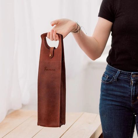 Whether you're heading to a dinner party or looking for the perfect gift, . Carry your favorite bottle in elegance or surprise a loved one with this timeless piece. ✨

Contact Us : +1 516 422-1111

👉 Swipe up to add a touch of class to your wine game!

#WineLover #LeatherGoods #WineAccessory #HandcraftedElegance #LuxuryGifts #WineNight #StylishTravel #GiftIdeas #LeatherLove #EtsyFinds #CraftedWithCare Leather Wine Carrier, Wine Games, Hunter Brown, Wine Carrier, Wine Night, Leather Artisan, Leather Art, The Hunter, Wooden Earrings