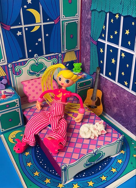 Vintage Betty spaghetti doll wearing pajamas and sitting on a vintage pink doll bed with a moon shining through the window. Betty Spaghetti Doll, Betty Spaghetti, Betty Spaghetty, Make The Bed, 2000s Nostalgia, Inner Child Healing, Im A Barbie Girl, Night Stands, Retro Toys