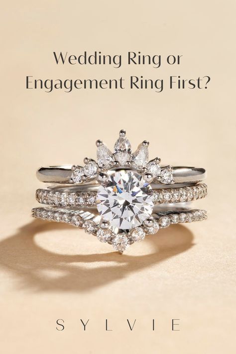 Are you wondering which ring to wear first? There is no right or wrong way and differs across cultures. While the most common way is to wear the wedding band closest to your heart and the engagement ring on the top after the wedding ring, people end up choosing what looks most aesthetically pleasing and feels most comfortable to them. Discover different wedding ring set ideas in this blog post! Sylvie. How To Wear Your Wedding Ring Set Classic Halo Engagement Ring, Wedding Ban, Eternity Band Set, Pre Engagement, Double Halo Engagement, Ring Exchange, Right Or Wrong, Stackable Wedding Bands, Set Ideas