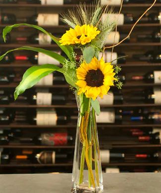 unique 3 flower bud vase floral design - Google Search Vase With Sunflowers, Whiskey Bottle Flower Vase, Jack Daniels Flower Vase, Sunflower Bud Vase, Rose And Sunflower Bouquet Vase, Sunflower Table Centerpieces, Tall Vase Centerpieces, Minimalist Centerpiece, Bud Vases Arrangements