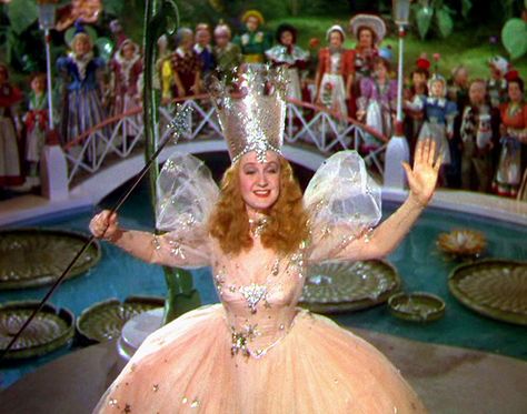 10 Best Gold Hair and Makeup Moments In Movies | Vogue Glenda The Good Witch, Billie Burke, Wizard Of Oz 1939, Glinda The Good, Glinda The Good Witch, The Wonderful Wizard Of Oz, The Wizard Of Oz, The Good Witch, Judy Garland