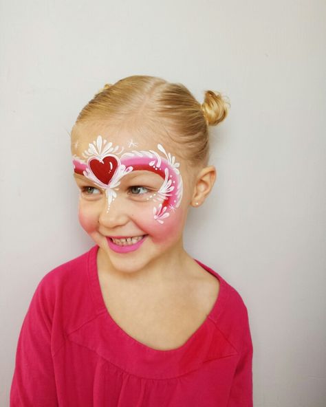 Valentines/heart  facepainting using one-stroke cake; by fanciful face painting Valentines Day Face Paint For Kids, Face Painting Heart, Valentine Face Painting For Kids, Valentine’s Day Face Paint, Valentines Face Painting Ideas, Valentine Face Paint, Valentines Day Face Paint, Hearts Face Paint, Heart Face Painting