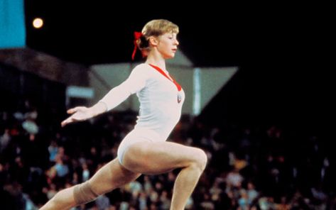 Gymnast Olga Korbut's daring 1972 Olympic routine has gone viral with over 2 million views on Twitter. Olga Korbut, Gymnastics Uniforms, 4 Months Pregnant, Alina Kabaeva, 1972 Olympics, Uneven Bars, Anna Pavlova, Gymnastics Pictures, Olympic Gold Medals