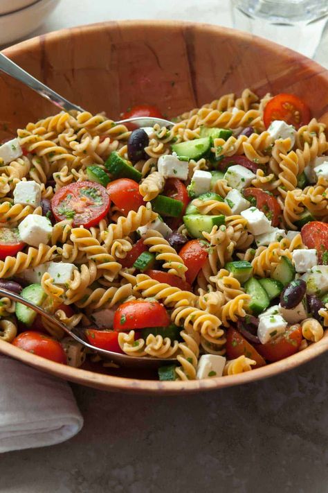 With crunchy cucumbers, juicy tomatoes, and creamy feta, this Greek-inspired cucumber and tomato pasta salad will be a hit at any picnic, party, or potluck. Feta Tomato Pasta, Cucumber Tomato Feta Salad, Tomato Feta Salad, Cucumber And Tomato, Tomato Pasta Salad, Creamy Feta, Persian Cucumber, Feta Salad, Cucumber Tomato