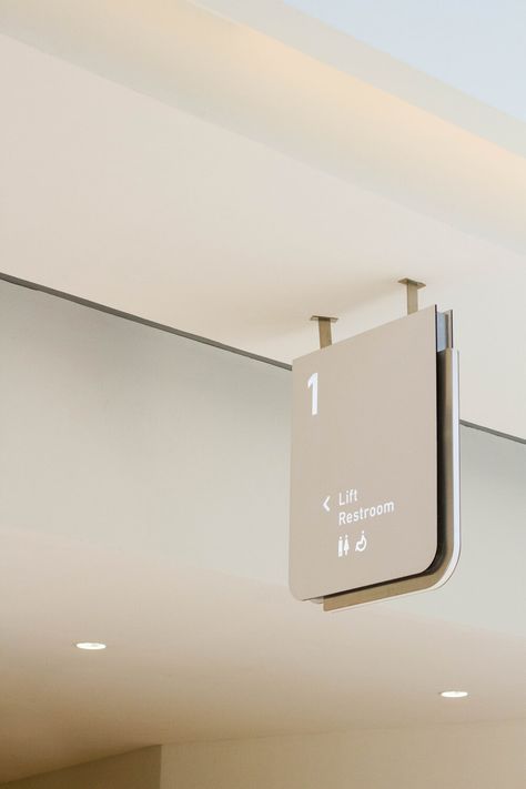 Amenity signage in matte white acrylic, featuring a brushed steel outline. Hospital Signage Design, Room Signage Design, Signage System Design, Interior Signage Design, Minimalist Signage, Office Signage Design, Hospital Signage, Interior Signage, Room Signage