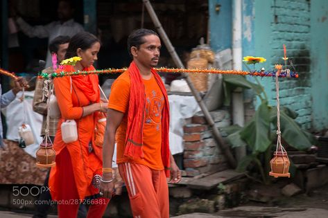 Bol Bam! #1 The Kanwar Yatra is an annual pilgrimage of devotees of Shiva known as Kanwariyas or "Bhole" or Shiv Bhaktas (disciples of Shiva) to Hindu pilgrimage places. Varanasi is one of them. They queue to the Ganga river to fetch holy water which is later offered at their local Shiva temples. The Kanwar Yatra takes place during the sacred month of Shravan (Saawan) - August. Most devotees observe a fast on Mondays during the month. Kanwar Yatra is named after the kānvar (कवड) a single pole (u Kawad Yatra Photo, Bol Bam Image, Bol Bam Photo, Kawad Yatra, Bhola Baba, Bol Bam, Ganga River, Jay Jagannath, Indian Wedding Couple Photography