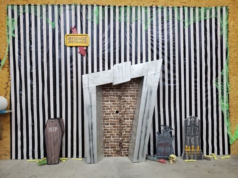 We had a Halloween party and went with the iconic Beetlejuice for inspiration. Beetlejuice Garage Door, Beetlejuice Office Decorations Diy, Beetlejuice Window Display, Beetlejuice Hallway Decorations, Bettle Juice Party Theme, Beetlejuice Outdoor Decor, Beetlejuice Fireplace Diy, Beetlejuice Backdrop Ideas, Beetlejuice Photo Booth