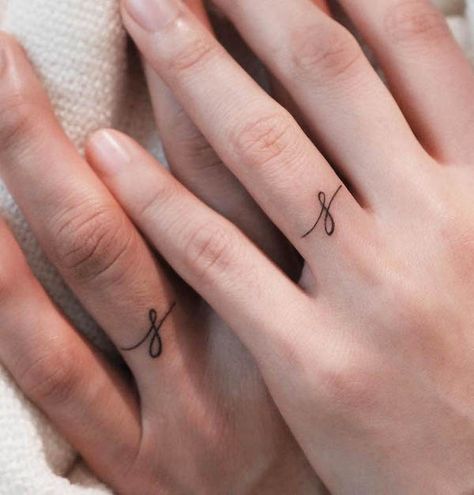 43 Wedding Ring Tattoos To Honor True Love - Our Mindful Life Ring Tattoo Designs Initials, Ring Finger Tattoo For Men Simple, Man Wedding Band Tattoo, Small Ring Tattoos For Women, Initial Finger Tattoo Wedding Bands, Small Ring Tattoos, Finger Tattoos Marriage, Initial On Ring Finger Tattoo, Initial Ring Tattoo