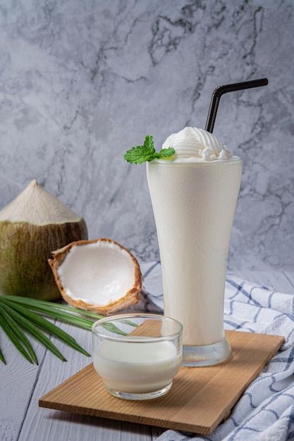 Young coconut juice smoothie in glass, f... | Premium Photo #Freepik #photo #coconut-shake #milkshake #shake #fruit-shake Ice Cream Milkshake, Coconut Shake, Coconut Milk Drink, Coconut Milkshake, Smoothie Glass, Tender Coconut, Coconut Juice, Food Photography Dessert, Ice Cream Smoothie