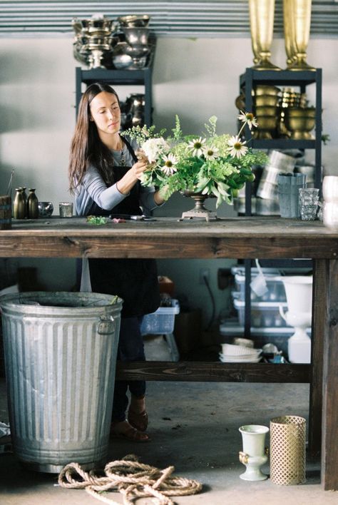 big, tall wood table with durable top, big garbage can, racks for hard goods...Honey of a Thousand Flowers // Sarah Winward Vase Storage Ideas, Floral Studio Work Spaces, Florist Studio Workspace, Florist Table, Shop Interiors Boutique, Sarah Winward, Industrial Studio, Flower Shop Interiors, Florist Studio