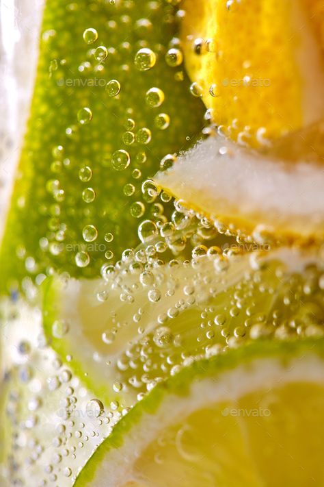 Homemade refreshing drink made from lemon and lime slices with bubbles. Macro photo of summer healthy lemonade Lemon And Lime Aesthetic, Fresh Drink Photography, Macro Drink Photography, Lemon Lime Aesthetic, Summer Drink Aesthetic, Lemon Water Aesthetic, Refreshing Pictures, Lemon Vodka Drinks, Lemonade Pictures