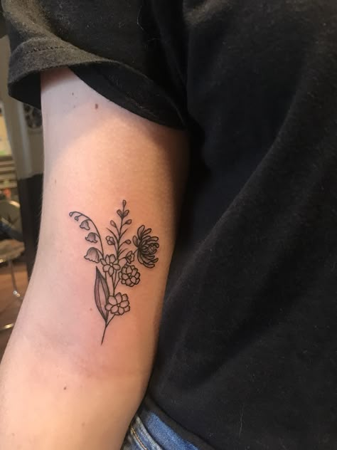 lily of the valley, larkspur and chrysanthemum arm tattoo. Tattoo Lily, Larkspur Tattoo, Lily Of The Valley Tattoo, Marigold Tattoo, Water Lily Tattoos, Lily Valley, Valley Tattoo, Lotr Tattoo, Tattoo White