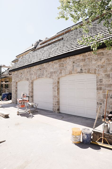 The Stone is Done on our Exterior! - Chris Loves Julia Cobble Stone House Exterior, White And Stone House Exterior Farmhouse, Craft Orchard Limestone Timberwolf, Stone Around Garage Doors, Overgrouted Exterior Stone, Cobblestone Home Exterior, Over Grout Stone Exterior, Cottage Exterior Stone, European Stone Exterior