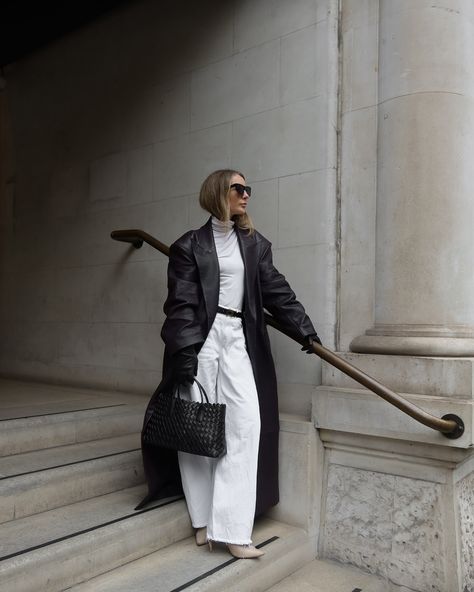 Hiding from the downpours in @giorgioarmani #whitejeans #jeansoutfit #leathercoat #autumnlook Barrel jeans | white jeans | leather trench | autumn outfit | all white outfit | leather gloves White Leather Trench Coat Outfit, White Button Up Leather Pants, Chic Long Winter White Fur Coat, Leather Jeans Outfit, Oversized White Long Sleeve Fur Coat, White Oversized Long Sleeve Fur Coat, White Jacket Outfit, Long Leather Coat, Leather Jeans