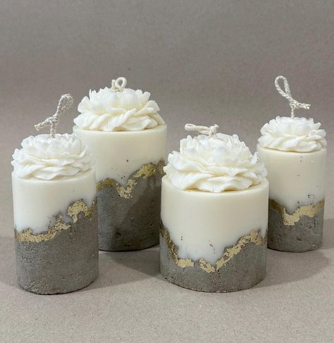 Introducing our exclusive Concrete candle. Each candle is fully handcrafted, ensuring that no two are ever alike, making yours a truly unique piece.       Our Concrete candle features a stunning combination of hard concrete and soft soy wax, blending with warmth and elegance of a candle. Adorned with gold accents and delicate flowers, tis candle is not just a source of light, but a statement piece for your home.         All-natural Soy wax and cotton wick.      Great gift for housewarming, birthday, Wedding, Thanksgiving Day, Christmas and any other holiday. Bougie Aesthetic, Concrete Vessels, Candle Making Studio, Concrete Candles, Candle Alternatives, Handmade Candles Diy, Fancy Candles, Cement Candle, Homemade Scented Candles