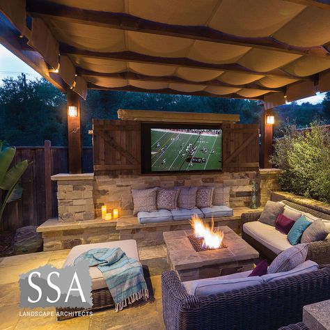 Outdoor Pergola With Tv Wall, Outdoor Tv Seating Area, Outdoor Tv Over Fireplace Ideas, Tv Outdoor Patio, Backyard Fire Pit Lounge Areas, Outdoor Grill Area With Tv, Back Porch With Fire Pit, Outdoor Tv Area Backyard, Outside Lounge Area