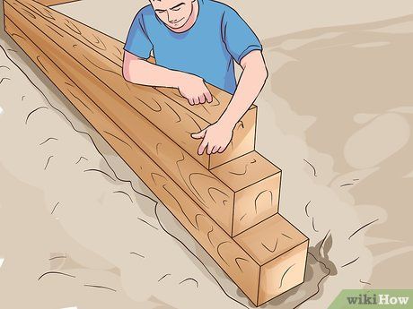 Image titled Build a Strong Retaining Wall with 4x4 Treated Post Step 11 4x4 Retaining Wall, Backyard Stairs, Cheap Retaining Wall, Wooden Retaining Wall, Retaining Wall Construction, Retaining Wall Steps, Diy Retaining Wall, Wood Retaining Wall, Backyard Retaining Walls