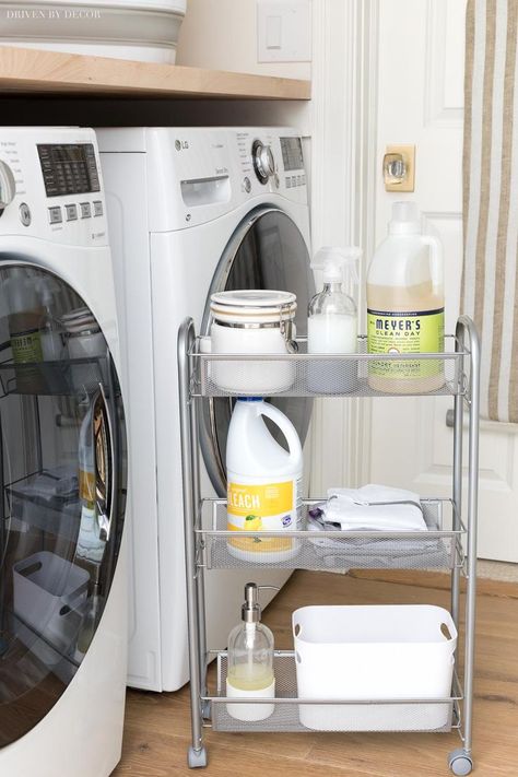 This slim rolling storage cart that goes between the washer and dryer for smart laundry room storage is everything!! #laundryroom #laundryrooms #laundryroomstorage Laundry Room Organization Between Washer And Dryer, Utility Cart Laundry Room, Slim Laundry Storage, Shelf For Between Washer And Dryer, Laundry Cart Organization, In Between Washer And Dryer Storage, Small Laundry Storage Ideas, Space Between Washer And Dryer, Laundry Room Cart