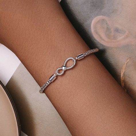 Buy S925 Sterling Silver Minimalist Infinite Loop Jewelry Women's Bracelet exclusively on www.shopperspointindia.com Experience the new design and superior quality of this must-have bracelet for fashion-forward women. With its stunning appearance, this bracelet is sure to impress. Don't miss out on this opportunity to elevate your style. Specifications include: chain lengths of 170mm and 190mm, wireless symbol measuring 8 * 18mm, and chain thickness of 3mm. This bracelet weighs approximately... Silver Infinity Bracelets, Basic Bracelet, Latest Bracelets, Silver Bracelets For Women, Bead Charms Diy, Beaded Bracelets Diy, Charm Bangle, Chic Jewelry, Bracelet Collection