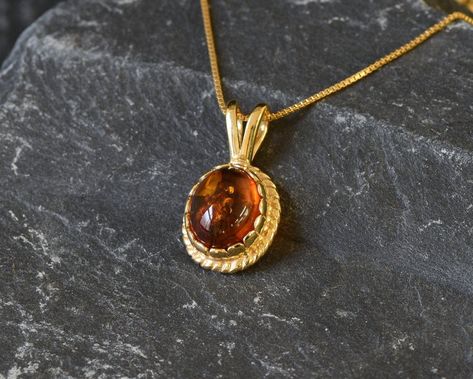 Gold Amber Pendant set with Natural Amber in the highest quality & brownish-yellow translucent resin, at 10x8mm, 3 Carats, sourced from Russia. Gold Dainty Pendant in Vintage design made of Gold Vermeil ☞ thickest 18k Gold Plating on top of Solid 925 Sterling Silver ☞ made to last. Free Gold Vermeil Chain with every Pendant order, 18 inch Silver chain (46 cm) ✓ Matching Ring & Earrings - please ask me ⌛Last Pendant left ⌛ ❀ Each Natural Gem is unique & will have Slight variations from the produc Faberge Jewelry, Amber Gemstone, Real Gold Jewelry, Amber Pendant, Matching Ring, Dainty Pendant, Natural Amber, Vintage Pendant, Gold Stone