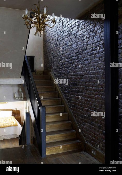 Download this stock image: Wooden staircase with exposed brick wall in residential home, UK. - 2F3MBP0 from Alamy's library of millions of high resolution stock photos, illustrations and vectors. Wooden Staircases, Exposed Brick, Brick Wall, Photo Image, Stairs, Stock Images, Stock Photos, Living Room, Building