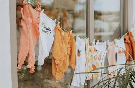 A Cutie Is On The Way Decor, Baby Clothes Line Decoration, Onesie Clothes Line Shower Ideas, Peachy Baby Shower Ideas, Clothes Line Baby Shower Decoration, Cutie Themed Party, Lil Cutie Baby Shower Theme Decor, Cutie On The Way Theme, Cuties Themed Baby Shower Ideas