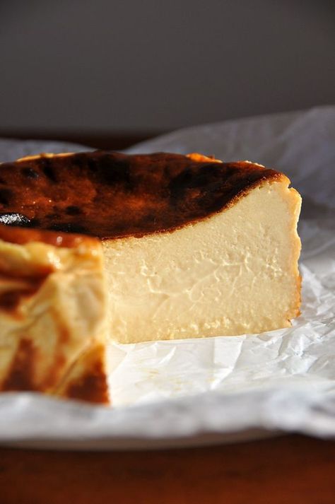 Perfectly creamy and smooth in the center with dark, caramelized edges, burnt Basque cheesecake (also known as San Sebastian cheesecake) is famous for a reason. This small-batch, gluten-free recipe makes a six-inch cake, so you don’t have to commit to pounds of cream cheese. Burnt Basque cheesecake has no crust and doesn’t require a water bath. Just mix all the ingredients and bake briefly at a very high temperature. The hardest part is waiting for it to chill overnight! Serves 6-10. Small Basque Cheesecake, Small Batch Cream Cheese Desserts, Bask Cheesecake Recipe, 6” Cheesecake Recipe, Cheesecake 6 Inch, San Sebastian Cheesecake Recipe, Gateau Basque Recipe, Small Cheesecake Recipe, 6 Inch Cheesecake Recipe