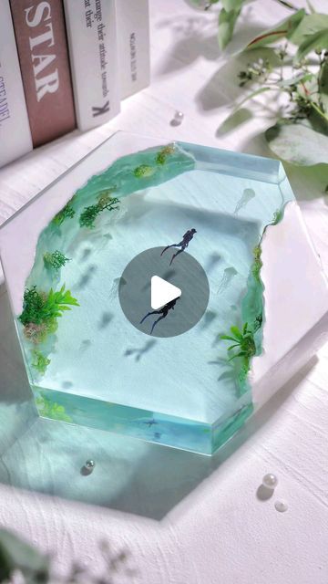 Let's Resin on Instagram: "💙 Let's explore the enchanting underwater world.  🌿 Witness the crafting process of this stunning underwater resin diorama, brought to life using our deep-pour resin kit. The underwater plants, delicately clinging to luminous rocks that radiate in the darkness, are meticulously bound together by our UV resin added with glow-in-the-dark powder. This is the key to its mesmerizing glow in the dark!  What do you think of it? Like it or love it? 😁 🔗Claim your 30% discount on our 51oz Deep Pour Resin with code: 𝟑𝟎𝐈𝐙𝟔𝟓𝐋𝐔. Link in our bio.   #letsresin #resinart #epoxyresin #resinepoxy #resincasting #dioramaart #diorama #resincreations #resindiorama #underwaterart #epoxyart #uvresincraft" Resin Underwater Scene, Deep Pour Resin, Uv Resin Crafts, Resin Arts, Resin Diorama, Underwater Plants, Epoxy Ideas, Underwater Art, Diy Resin Projects