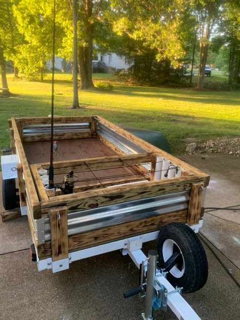 Burnt wood tilting utliity trailer with storage and fishing rod holders Rv Fishing Pole Storage, Diy Utility Trailer, Diy Trailer Tongue Storage, Truck Fishing Rod Holder, Trailer Tongue Box, Fishing Rod Holders, Utility Trailer Rebuild, Rod Holders, Burnt Wood