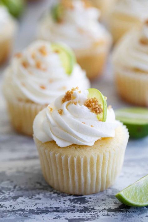 Tart and sweet, these Key Lime Cupcakes are lightly lime flavored cupcakes filled with key lime pie filling and topped with a sweet key lime buttercream. Don’t forget the graham cracker crumble on top! #cupcakes #lime #keylime #dessert #baking Keylime Dessert, Key Lime Pie Filling, Key Lime Buttercream, Key Lime Pie Cupcakes, Lime Dessert, Lime Buttercream, Flavored Cupcakes, Key Lime Recipes, Key Lime Cupcakes