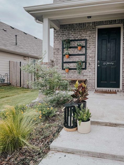 small suburban front porch with a plant wall Brick Wall Decor, Front Porch Plants, Porch Wall Decor, Painted Brick Walls, Porch Plants, Wall Clips, Plant Clips, Hanging Plant Wall, Diy Front Porch