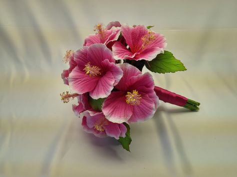 Hot pink hibiscus wedding bouquet, perfect for the beach!! From www.hibiscusbeachweddingflowers.com Pink Hibiscus Wedding Bouquet, Bouquet Of Hibiscus Flowers, Pink Hibiscus Bouquet, Hibiscus Bouquet Wedding, Hibiscus Wedding Bouquet, Hibiscus Flower Bouquet, Beachy Wedding Dress, Hibiscus Bouquet, Hibiscus Wedding