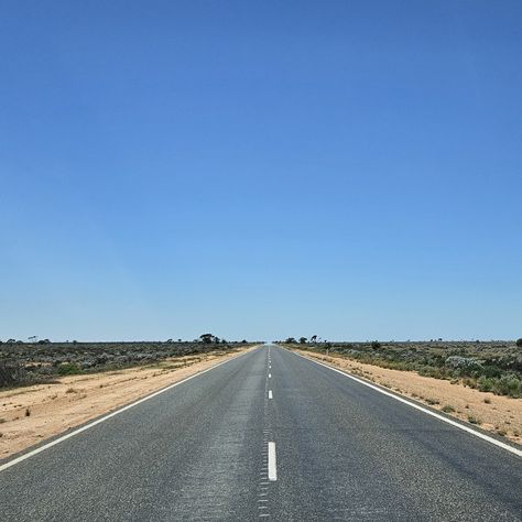 Here is a wanderlust test: The Eyre Highway which connects Western Australia and South Australia, is a perfectly straight, over 1000 miles long, stretch of road that cuts through the desolate Nullarbor Plain. The endless horizon weighs down on everything and even the trees do not dare to grow, leaving space only to timid bushes. When you cross another sporadic driver, you salute them, like two sailors meeting in a vast ocean. Driving through the Nullarbor Plain becomes almost a character de... Nullarbor Plain, Vast Ocean, A Character, South Australia, The Endless, Western Australia, Trees, Australia, Road