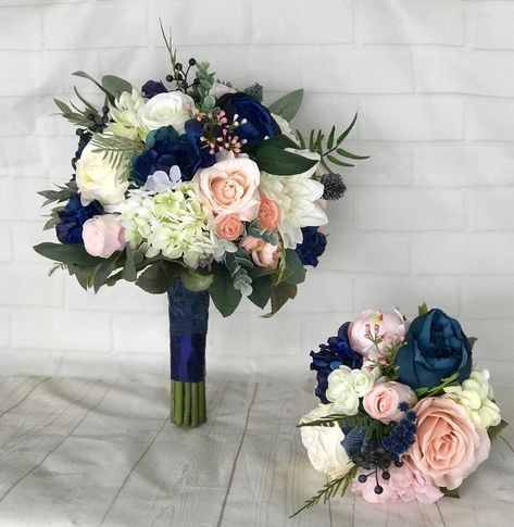 This romantic, beautiful faux floral bouquet is on trend and will be a stunning addition to make your special day one to remember. Handmade in shades of blush, pink, white, ivory and navy blue with peonies, ranunculus, garden roses, hydrangea, spray roses, berries, seeded eucalyptus, dusty miller, fern, boxwood and silk greenery. Stems are wrapped with a coordinating satin ribbon. Heathers Flower, Bridal Bouquet Navy, Bouquet Navy Blue, Navy Wedding Bouquet, Homecoming Flowers, Blush Bouquet Wedding, Navy Wedding Flowers, Blush Bridal Bouquet, Bridal Bouquet Pink