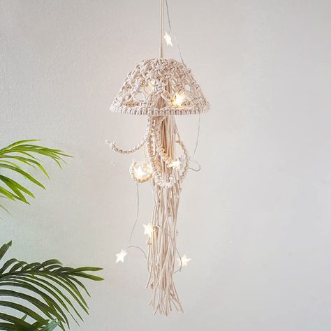 PRICES MAY VARY. HANDMADE JELLYFISH : The jellyfish macrame wall hanging are made of 100% natural cotton rope. It was woven by craftsmen for many years, real like delicate in details. A perfect handmade wall ocean decor. Size: 55 x 20 cm / 21.7 x 7.9 in. UNIQUE WALL DECOR: Unique design, jellyfish after hours of knotting, meticulously handcrafted, using materials giving a minimalist feel and creating a relaxed feel in the room. Also perfect for theme room decor or seaside hotel / office / studio Ocean Room Decor, Tapestry Macrame, Coastal Nursery, Beach Nursery, Sea Nursery, Ocean Room, Mermaid Room, Ocean Nursery, Living Room Nursery