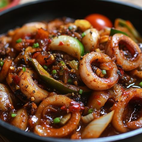 🦑🍛 Dive into the savory goodness of Adobong Pusit—tender squid cooked in a tangy, flavorful adobo sauce! 😋 #AdobongPusit #FilipinoFavorites Adobong Pusit (Squid Adobo) Ingredients: Squid (500g, cleaned and sliced) Soy sauce (1/4 cup) Vinegar (1/4 cup) Garlic (4 cloves, minced) Onion (1, chopped) Tomato (1, chopped) Bay leaf (1) Black peppercorns (1 tsp) Salt and pepper (to taste) Instructions: Sauté garlic, onion, and tomato in a pan until softened. Add squid, soy sauce, vinegar, bay leaf... Squid Adobo Filipino Food, Squids Recipe, Adobo Ingredients, Pusit Recipe, Adobong Pusit, Squid Recipes, Instagram Recipes, Savory Food, Adobo Sauce