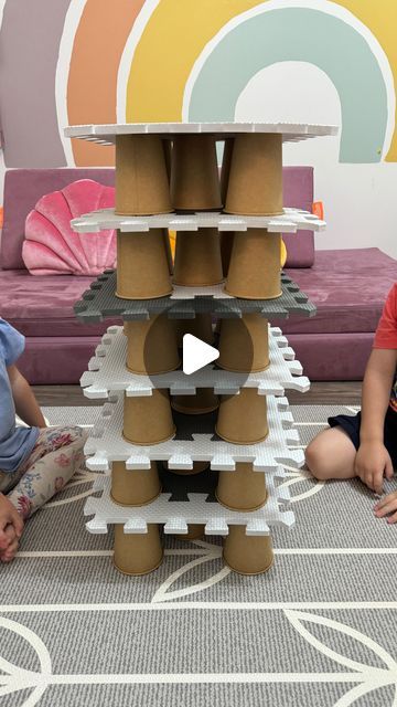 Desiree Blanchard, M.H.K | Baby & Toddler Play on Instagram: "✨🤍The best DIY JENGA game to try at home! The best part? You only need two materials that you most likely have on hand! 🙌🏻

➡️Follow @lovebloomlearn for more easy play ideas! 🧚‍♀️

To recreate this activity, we used paper cups (paper or plastic cups are perfect) and we used our kids foam play mat to help built the tower. That’s all ! Give it a try today if you’re looking for an easy activity. 

👶🏼👶🏽👶🏾Activity is recommended for toddler and preschoolers +. An adult should supervise all activities. 

✨🌈For more easy play ideas, check out my “Baby and Toddler Caregiver Play & Milestone guides.” It’s loaded with tips, milestones & play ideas! 🔗Link in bio. 

•
•
•

#messyplay #messyplaytime #messyplayideas #tastesafesens Stacking Cups Activity, Diy Jenga, Foam Play Mat, Jenga Game, Messy Play, Easy Activities, Toddler Play, Play Ideas, Paper Cups