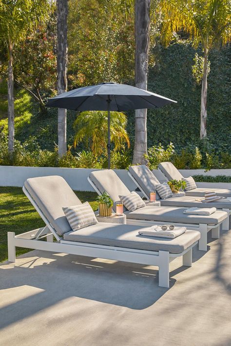 Building the perfect outdoor chill area will be all the rage this summer. #PatioDesign #PatioFurniture #OutdoorLiving Pool Patio Furniture, White Lounge Chair, Mid Century Modern Outdoor, Outside Pool, Pool Lounge Chairs, Ground Pool Ideas, Pinterest Trends, Outdoor Loungers, Pool Chairs