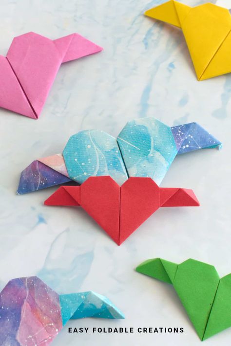 Origami Heart With Wings | Easy Foldable Creations Mini Origami Hearts, Origami Santa Hat, Envelope Diy Paper, Easy Origami Heart, Origami Box With Lid, Origami Heart With Wings, Christmas Tree Napkin Fold, Origami Santa, Origami Swan