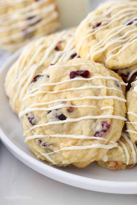 Soft and Chewy Cranberry Orange Cookie with a white chocolate glaze. They're buttery, perfectly chewy with crisp edges, and bursting with flavor. These make a great Christmas cookie! Cranberry Cheesecake Bars, White Chocolate Glaze, Beyond Frosting, Cranberry Orange Cookies, Cookie Recipes Decorating, Cookie Cups Recipe, White Chocolate Cranberry Cookies, Best Christmas Cookie Recipe, Easy Christmas Cookie Recipes