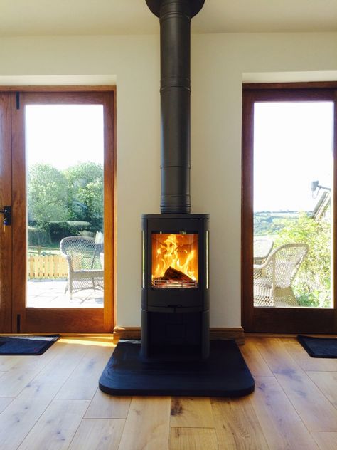 Kernow Fires Contura 850 between two doors wood burning stove installation in Cornwall. Wood Burning Stove Between Windows, Fireplace Between Two Doors, Redruth Cornwall, Contemporary Wood Burning Stoves, Wood Burner Fireplace, Fire Stove, Stove Installation, Light Wood Kitchens, Slate Hearth