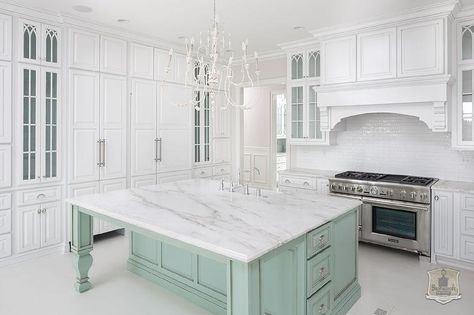 A whitewashed French candle chandelier illuminates a mint green kitchen island with turned legs topped with white marble with gray veining fitted with a farmhouse sink and deck mount faucet. Kitchen Island With Legs, Maximize Kitchen Space, Mint Green Kitchen, Green Kitchen Island, Kitchen Island Storage, Aqua Kitchen, Kitchen Island With Sink, Grey Kitchen Island, Green Island