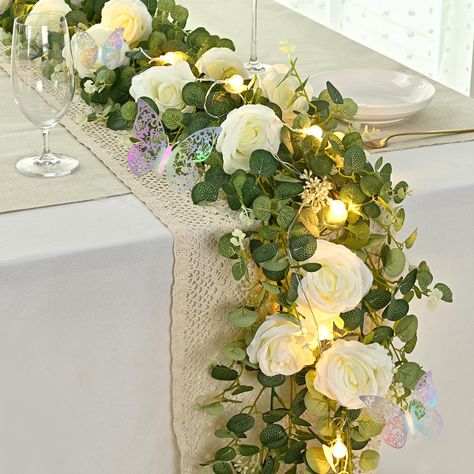 PRICES MAY VARY. Density Upgrade & Fuller Eucalyptus Garland: Discover the upgraded, full-bodied beauty of our 6.4 ft eucalyptus garland with white rose flowers - now featuring enhanced density and lights for an even more lush and stunning visual effect. Experience an unparalleled level of quality and sophistication that will leave your guests in awe and elevate any space. Light Up Your Space: Step into a magical fairy tale world with our enchanting 6.6 ft lights, just like the fairy godmother c Botanical Baby Shower Decor, Daisy Table Decorations, White Flower Garland, Butterfly Wedding Decorations, Room Backdrop, Table Centerpiece Wedding, Daisy Decorations, Crystal Globe, Artificial Eucalyptus Garland